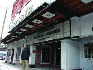 A SECOND CHANCE: Oneonta Theatre owner, Tom Cormier, stands in front of the venue’s marquee, announcing its first concert booked in partnership with “Friends of the Oneonta Theatre.” 