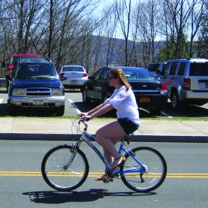 Sophomore Meghan Wilcox riding her bike instead of driving a vehicle